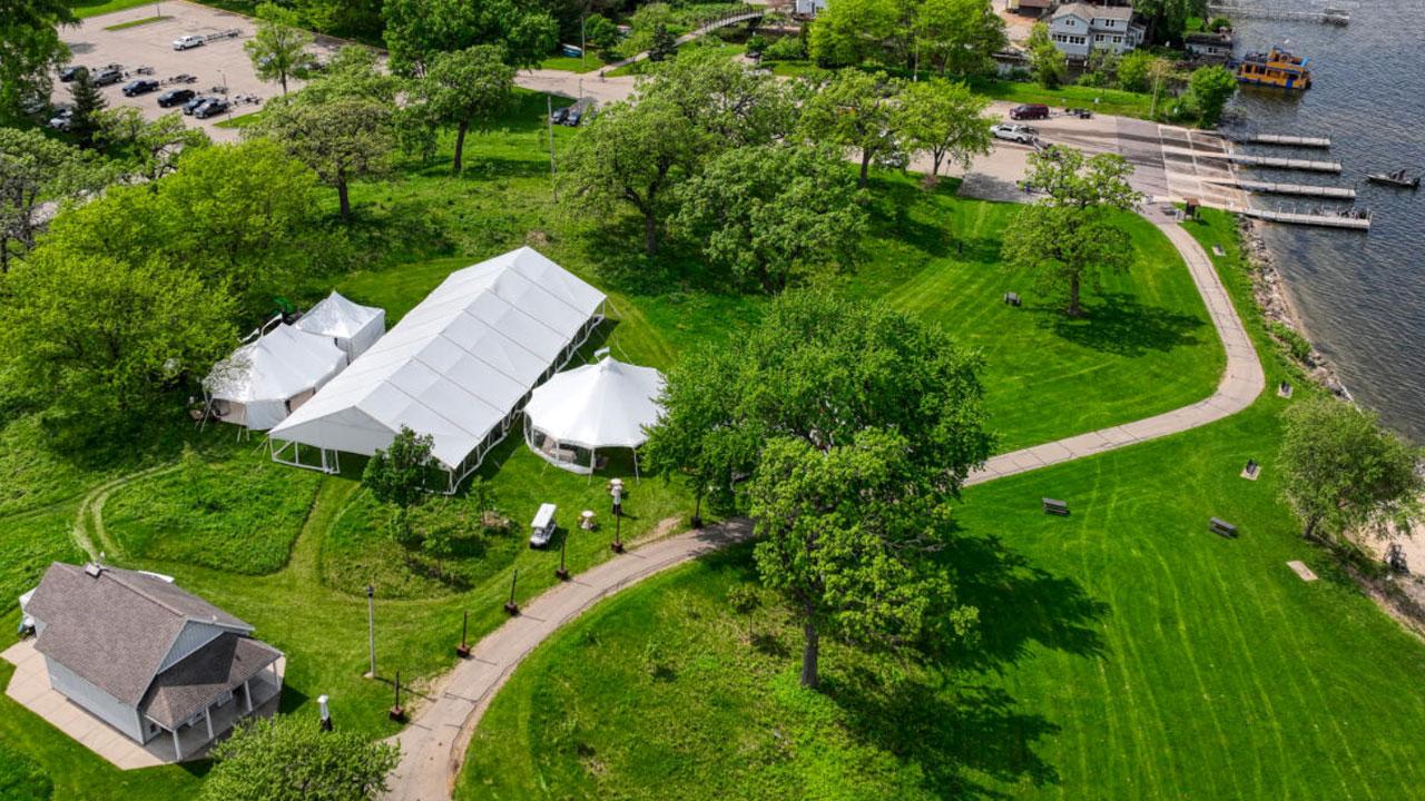 Luxurious tents sitting on the edge of a lake